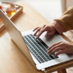 Woman working on laptop online