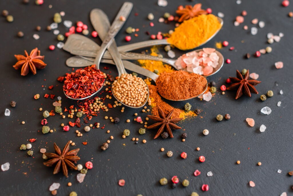 Spices and herbs on old kitchen table. Food and cuisine ingredients